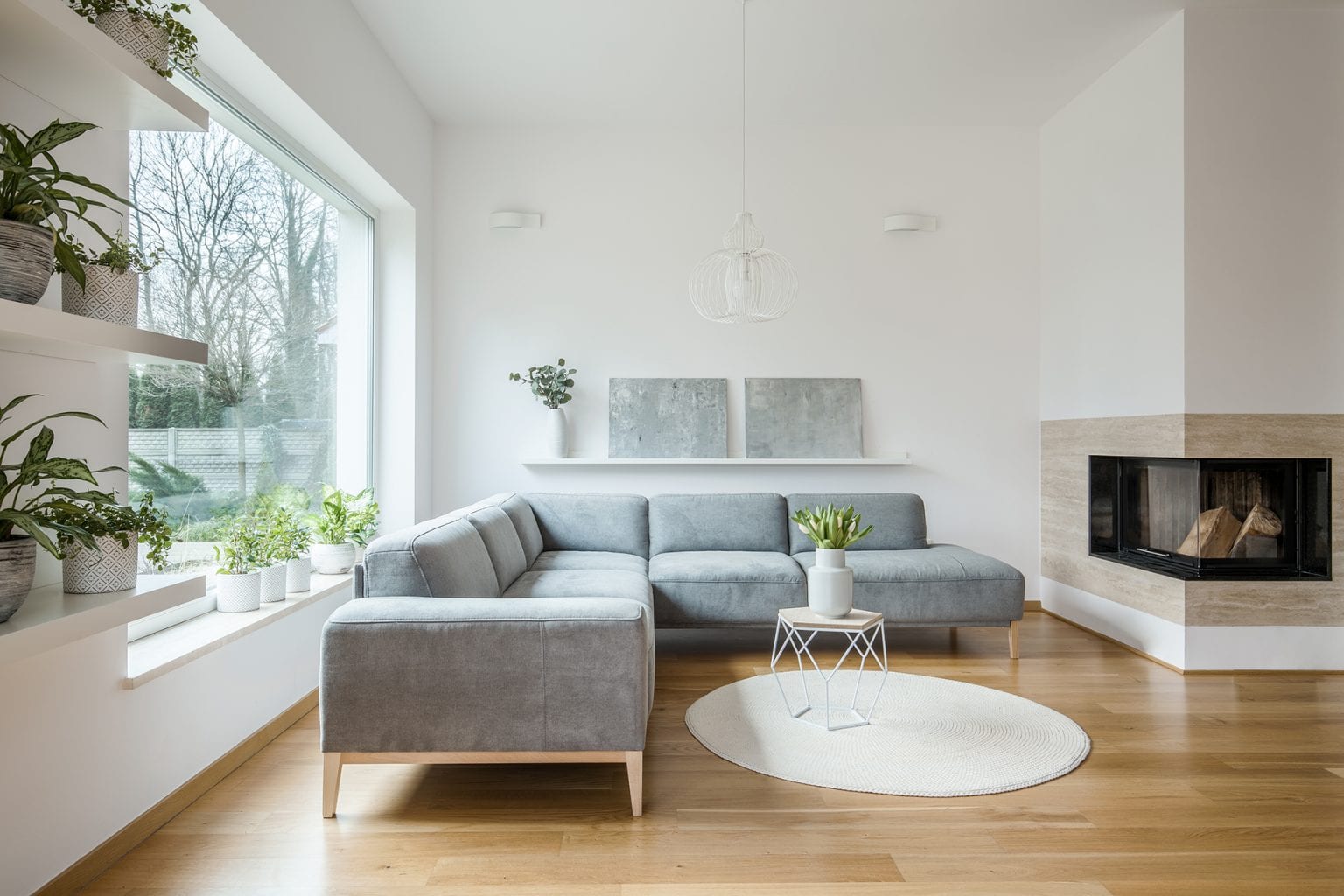 grey-corner-lounge-standing-in-white-living-room-i-FKNUTZ3-1536x1024